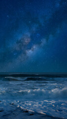 Fototapeta premium Ocean waves under a starry sky create a serene and mystical atmosphere.