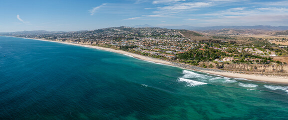 Panoramic aerial view of San Clemente coastline showcasing pristine beaches and vibrant ocean waves