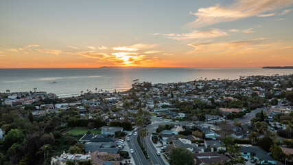Aerial view of San Clemente California coastline during sunset showcasing beaches and vibrant ocean colors