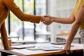 Close up of business handshake. Asian business people making a handshake, 
