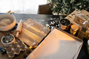 Table ready for cooking gingerbread, cookie or cake. All kitchen equipment ready to prepare ginger...