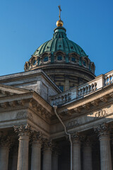 lose-up view of the Kazan Cathedral's ornate dome and classical columns in St. Petersburg, Russia, highlighting the neoclassical architecture under a clear blue sky
