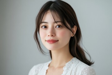Fototapeta premium Bright and Clear Portrait of a Young Woman with Small Flowers in a Soft and Elegant Arrangement