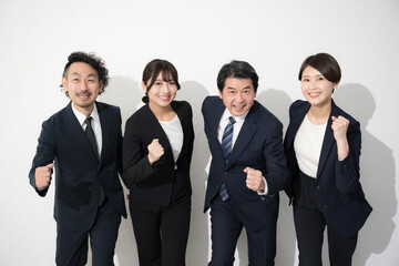 Image of goals, future, running, starting, multiple camera-ready businessmen posing with guts, white background