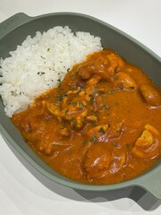 A comforting bowl of Japanese curry, featuring a rich, savory sauce with tender vegetables and chunks of meat, served over fluffy rice. A warm, flavorful dish perfect for any meal.
