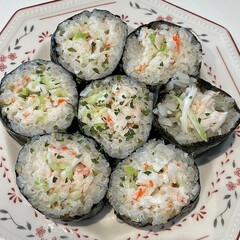 Korean Seaweed Rice Rolls or Kimbap Korean dish made from cooked rice vegetables, meats that are rolled in seaweed, BBQ Kimbap Korean food Isolate on white with clipping path.
