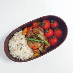 A traditional Korean dosirak, beautifully arranged with rice, assorted banchan, and savory proteins. Balanced and visually inviting, it’s a portable meal packed with vibrant flavors.
