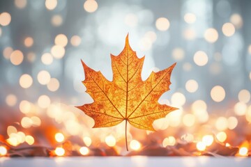 Fototapeta premium Autumn Leaf with Warm Bokeh Background