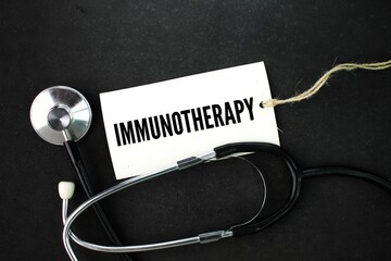 stethoscope and paper tag with the word Immunotherapy. treatment that uses a person's immune system...