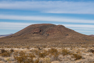 Cinder Cone / Scoria Cone with Lava Flow. Cima volcanic field. Kelbaker Road, Mojave National Preserve. San Bernardino County, California. Mojave Desert / Basin and Range Province.