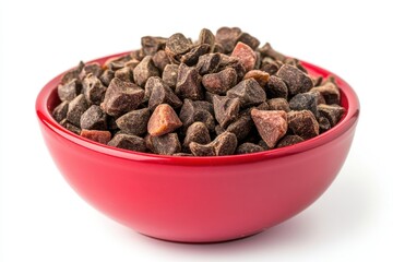 Red bowl filled with cacao nibs. Perfect for healthy food, recipes, or blogs.