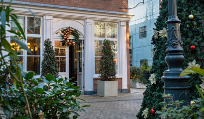 entrance cafe shop Christmas decorations tree wreath front doors The Hague