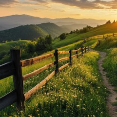 Fence near hillside path in mountains