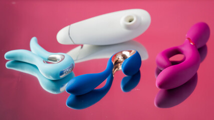 Set of various sex toys on a mirror background. 