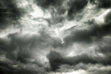 A dark and stormy sky with clouds.