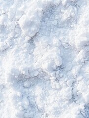Fototapeta premium A close-up view of textured white snow or salt, showcasing its crystalline structure and fluffy appearance.