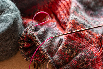 colorful knitted work in progress, handicraft concept, knit texture, wool handicrafts, hobby
