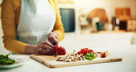 Hands, cook and healthy food as recipe for nutrition in kitchen for cooking, meal prep and cutting. Person, chopping board and culinary arts with vegetables, ingredients and apron for cuisine in home