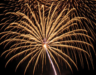 Golden firework fireworks on dark black night sky texture