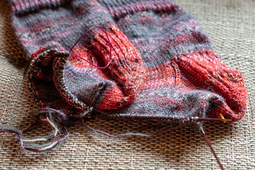 colorful knitted work in progress, handicraft concept, knit texture, wool handicrafts, hobby