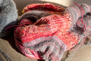colorful knitted work in progress, handicraft concept, knit texture, wool handicrafts, hobby