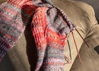 colorful knitted work in progress, handicraft concept, knit texture, wool handicrafts, hobby