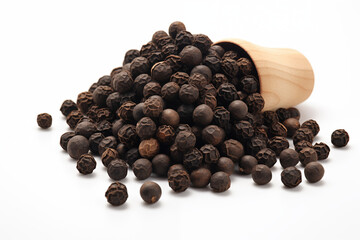 High-quality close-up of rounded black peppercorns scattered on a clean white background, showcasing their texture and natural details