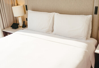 White pillows on the bed in modern bedroom
