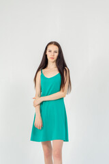 Obraz premium Slim cute young woman standing on a white background. Copy space