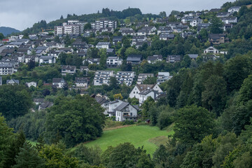View of white residential buildings in a small town in the nature of Germany