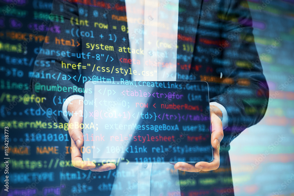 Aufkleber Businessman holding transparent tablet with programming code overlay on a digital background.