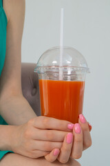 Close-up of a cocktail in a woman's hands