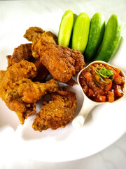 a close up of Thai style fried chicken. ayam goreng ketumbar. 