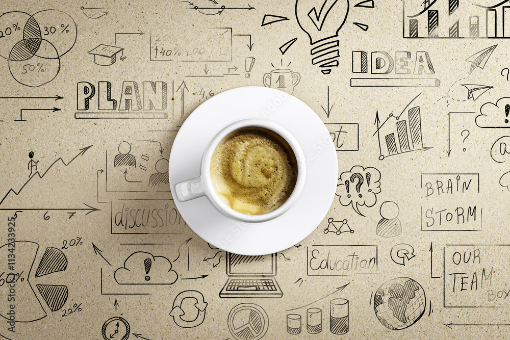 Aufkleber coffee cup on a desk with hand-drawn sketches and diagrams in the background, representing creative 