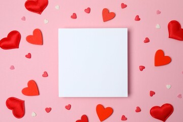 Beautiful hearts with paper card on color background