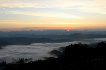 Sunrise  over the mountain  at Doi Samer Dao - Si Nan National Park,  in Nan province northern of Thailand.