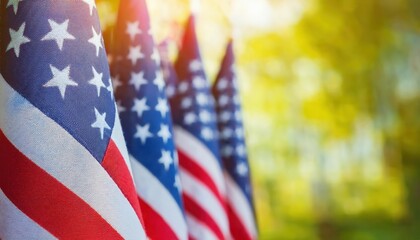 Close-Up View of Vibrant American Flags Waving Outdoors on a Sunny Day with Golden Light and Greenery in the Background. Perfect for Celebrating Patriotic USA Holidays, Memorial Day, or July 4th Event