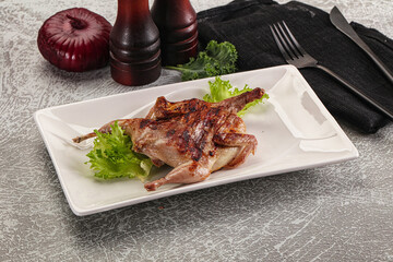 Grilled quail in the plate