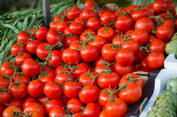 a box of tomatoes in a market