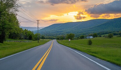 Scenic country road at sunset with mountain view.
