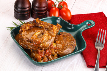 Italian cuisine - ossobuco with sauce