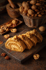 Cake with brown sugar, walnuts, and cream.