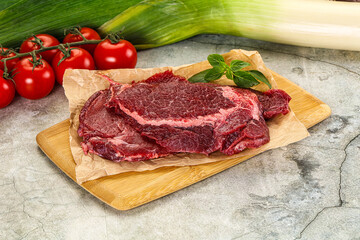 Raw beef cheeks cut for cooking