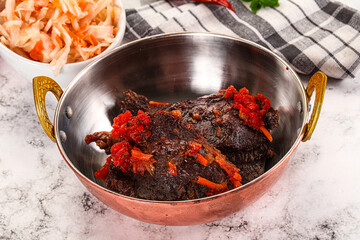 Baked beef cheeks with vegetables