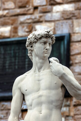 Obraz premium Detail of the sculpture David - by Michelangelo, first presented to the public in the Piazza della Signoria in Florence on June 8, 1504.