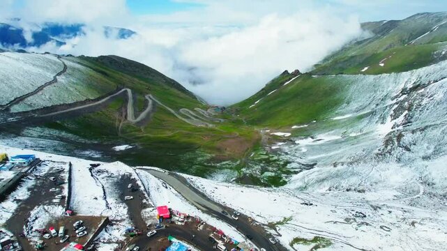 Snow fall on the mountains top view of mountains with drone video fotage 4k hd resulation