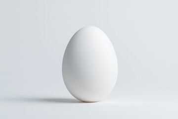 Beautiful clean egg isolated on white background in a minimalistic setting with natural light