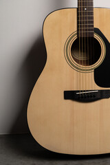 wooden guitar close-up on a white background