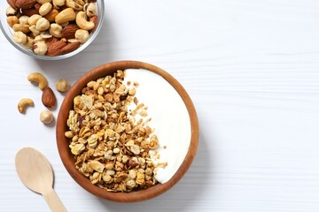 Delicious granola with yogurt on a light background