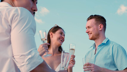 Group of business friends together celebrating and enjoying party with drinking champagne on sail...